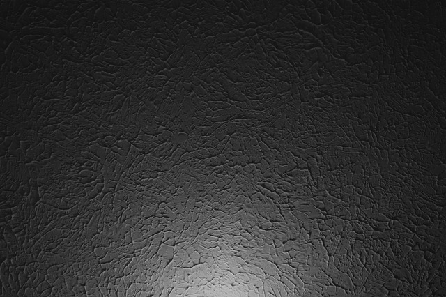A stucco ceiling with a hint of light at the bottom