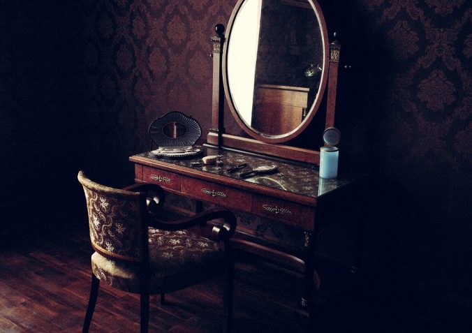 A Victorian-style vanity and mirror